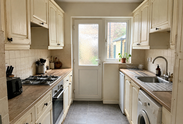 Honey oak kitchen cupboards before painting in Hatfield