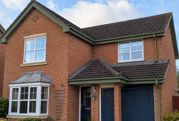 Bargeboards and gutters in Northampton after painting, with a smarter more unified appearance