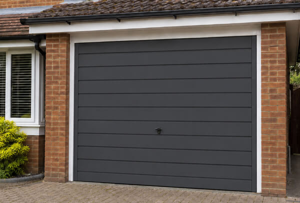 Garage door after repainting, showing a cleaner and more modern finish