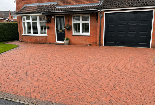 Block paving driveway in Northampton after cleaning, with a cleaner and more even finish
