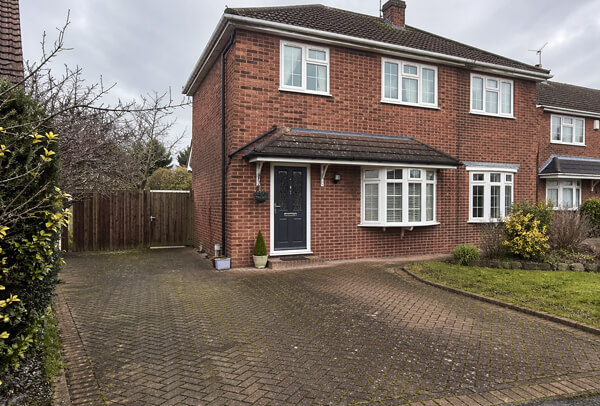 Brick driveway in Northampton before cleaning, with dirt and weather staining
