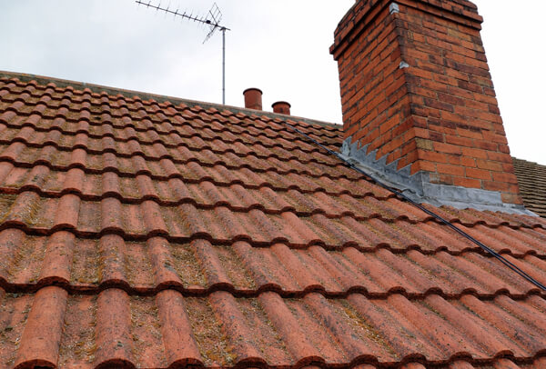 Clay tile roof before cleaning in Milton Keynes