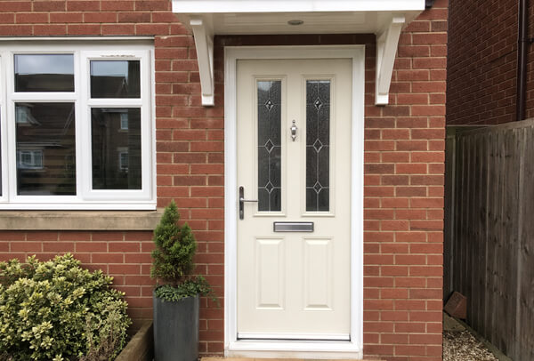 Composite front door in Northampton before painting, with a dated colour and tired finish