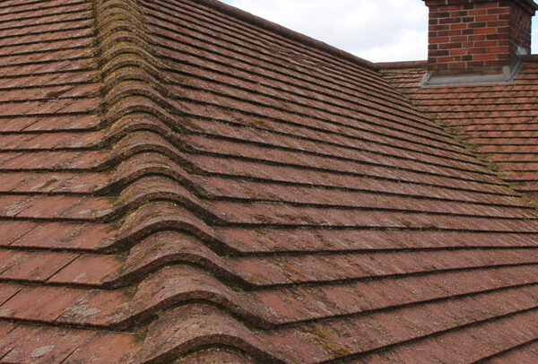 Concrete tile roof before cleaning in Milton Keynes
