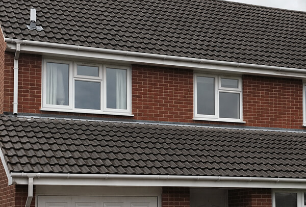 Concrete tile roof in Northampton after cleaning, with a cleaner and tidier finish
