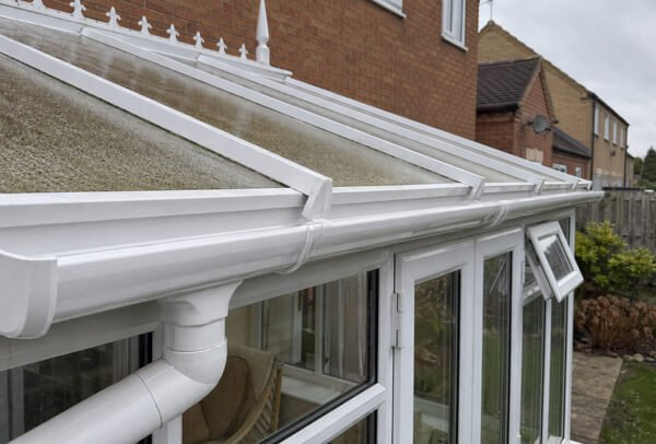Conservatory gutter in Northampton after cleaning, clear and draining properly