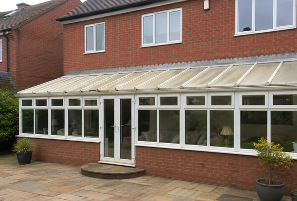 A usable conservatory before its tired frame finish was updated