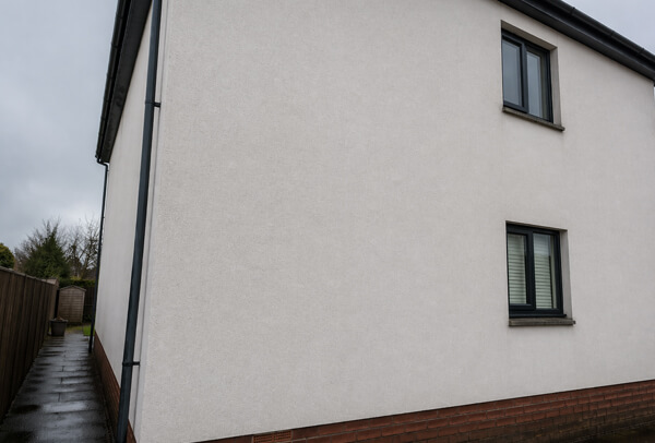 Exterior wall in Northampton after house washing, looking cleaner and more presentable