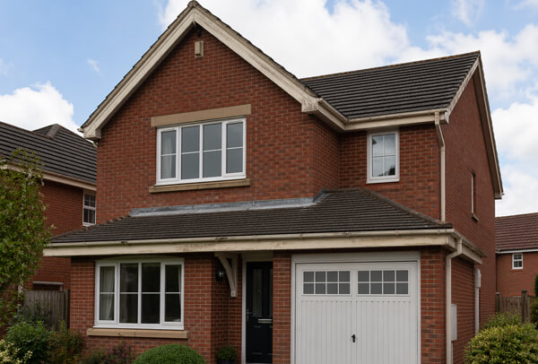 Fascias and soffits in Northampton before painting, with faded and weathered surfaces
