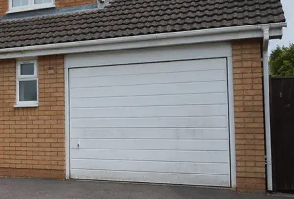 Faded fibreglass garage door before painting