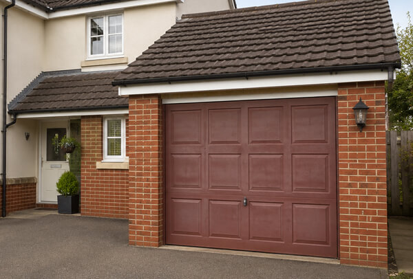 Garage door before a colour change, showing an older finish