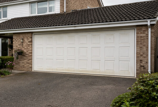Tired garage door before being repainted