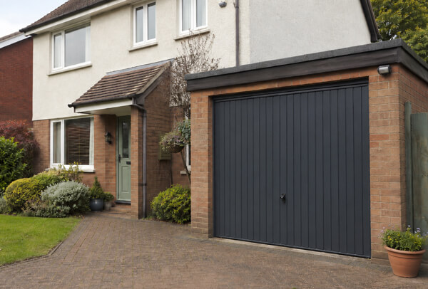 Garage door after preparation and painting, showing a clean even finish