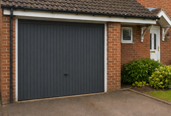 Garage door after repainting, showing a refreshed finish without replacing the door