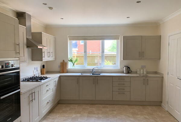 Kitchen in Luton before cupboard painting and decorating with tired units and walls