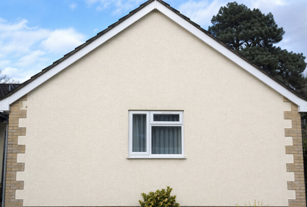Rendered exterior wall in Northampton after cleaning, with a cleaner brighter appearance