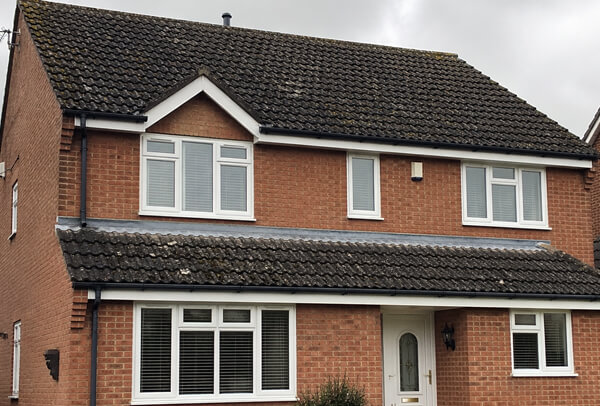 Roof in Northampton before a professional cleaning transformation