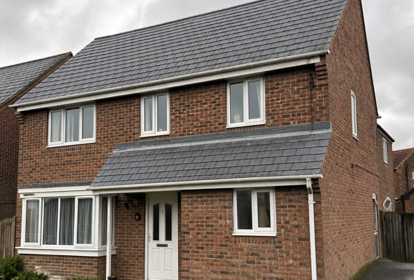 Slate roof in Northampton after cleaning, with a cleaner and more attractive overall finish