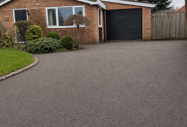 Tarmac driveway in Northampton after cleaning, with a cleaner better-maintained surface