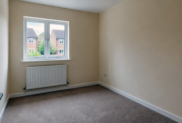 Room in Northampton before wallpapering, with plain or tired walls