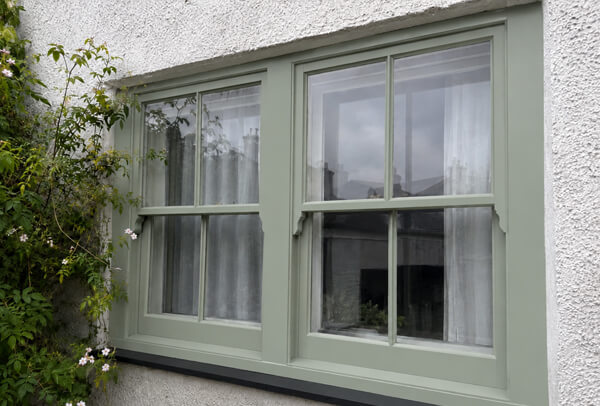 Window frames after suitable preparation and painting in Hatfield