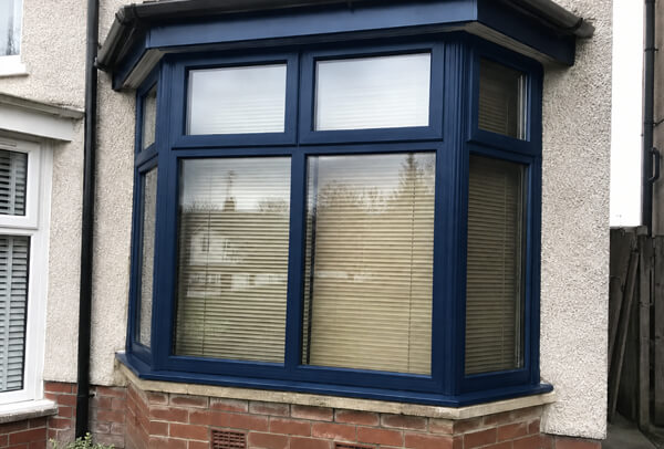 Window frames after neat masking and repainting in Hatfield