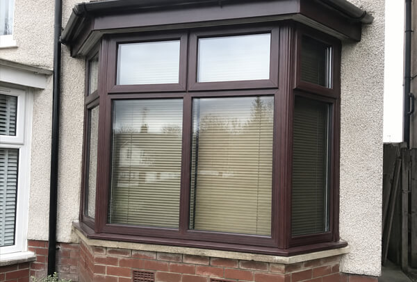 Window frames before masking and repainting in Hatfield
