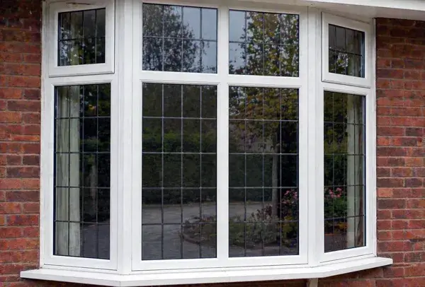 Window frames in Northampton before painting, with a tired and dated appearance