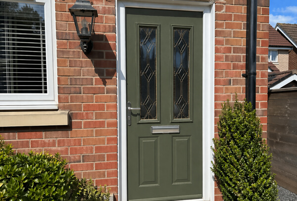 Wooden front door in Northampton after painting, with a refreshed and better-kept appearance