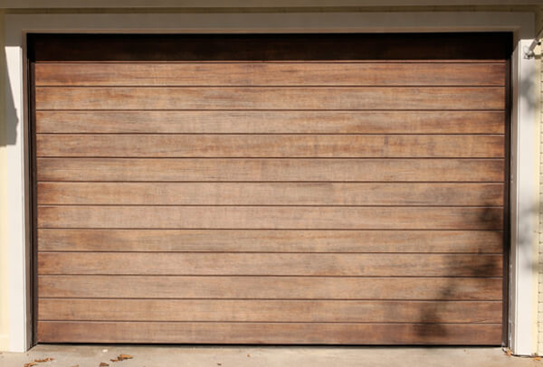 Timber garage door before painting in Milton Keynes