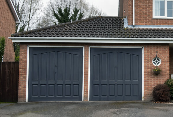 The same wooden garage door after a fresh painted finish