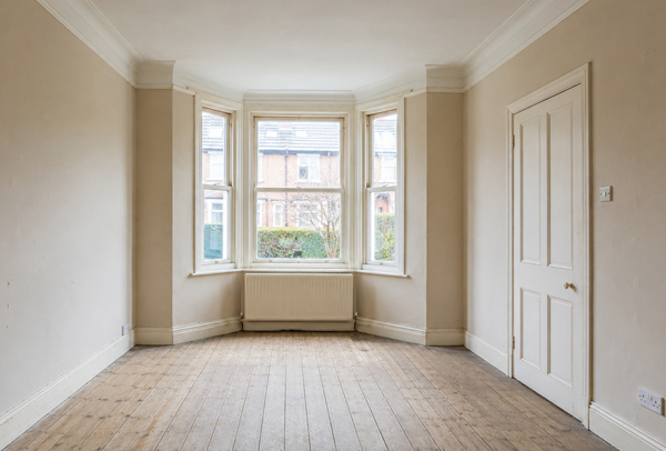 Room in Hatfield before wall painting with marked walls and an older colour