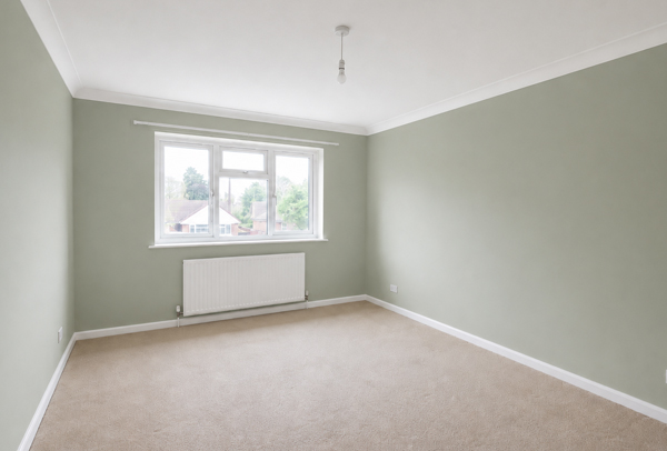 Lived in room in Hatfield after painter and decorator work with clean colours and neater woodwork