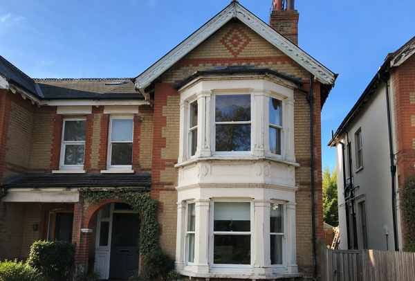 Roofline trim before painting in Hatfield with faded exterior details