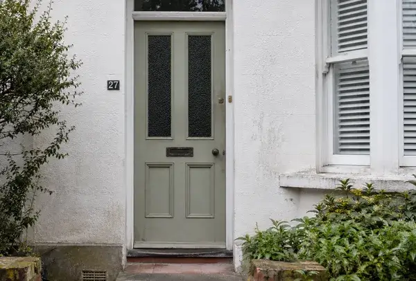 Tired front door before being repainted