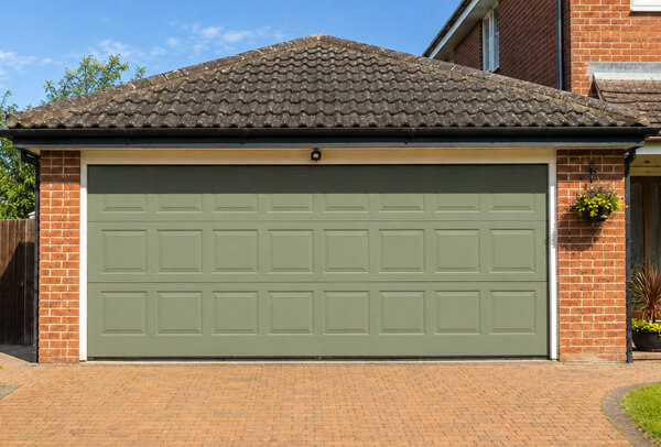 Weather faded garage door after repainting in Wellingborough