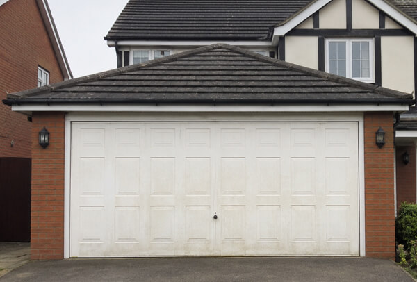 Garage door before repainting viewed from the driveway in Kettering