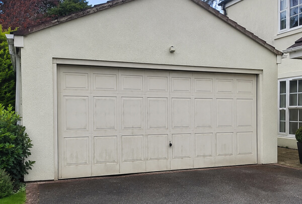 Faded garage door before painting in Kettering