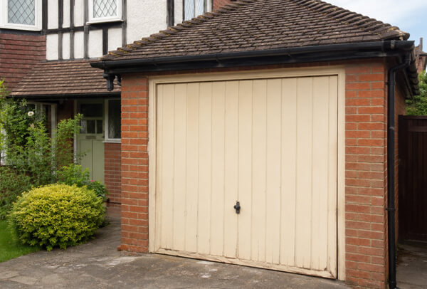 Weathered garage door before preparation in Kettering