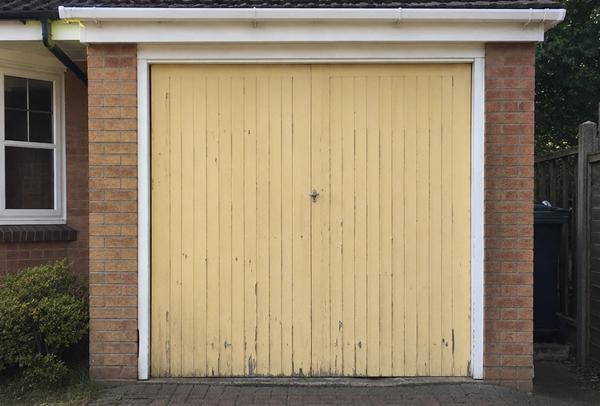 Timber garage door before painting in Aylesbury