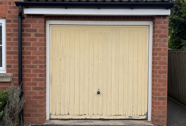 Older coloured garage door before painting in Aylesbury