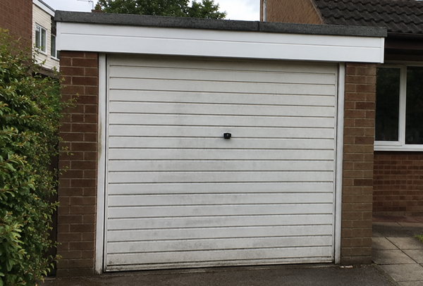 Metal garage door before repainting in Aylesbury