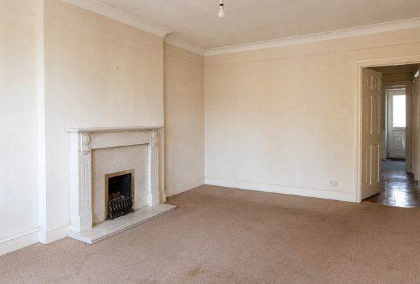 Room in Leighton Buzzard before painter and decorator work with tired walls and older woodwork
