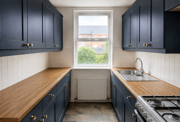 Painted kitchen cabinets after a soft green and white refresh in Kettering