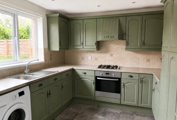 Kitchen cupboards after a calm neutral repaint in Kettering