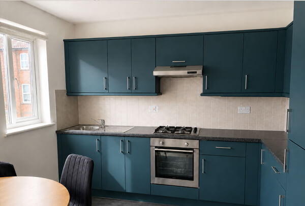 Two tone painted kitchen cabinets after refurbishment in Kettering