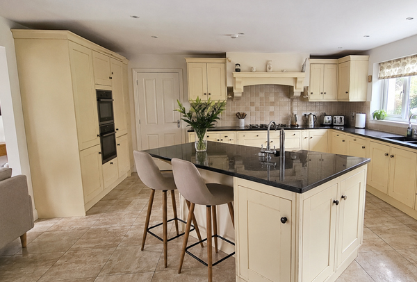 Kitchen cabinet doors with worn handle areas before preparation in Kettering
