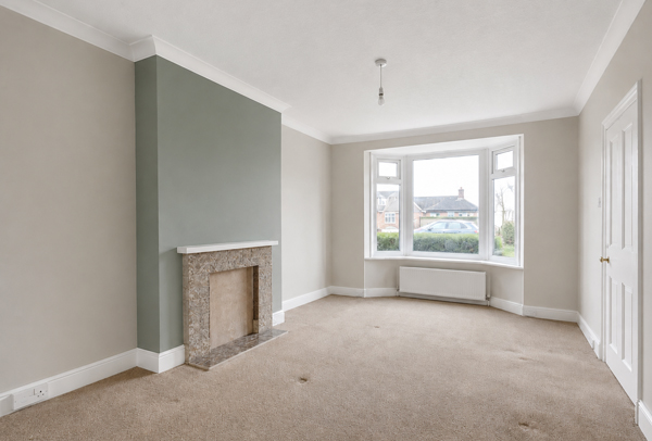 Living room in Stevenage after painting and decorating with fresh walls and clean woodwork