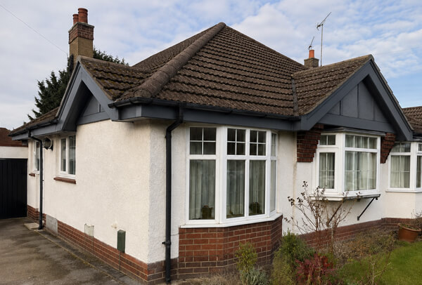 Bargeboards gutters and downpipes after painting in Kettering